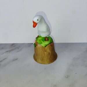 intage porcelain or ceramic goose bell featuring a hand-painted white goose